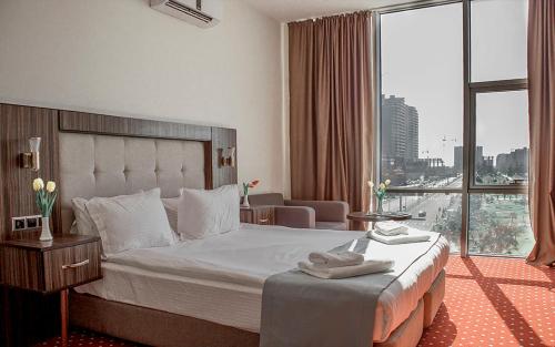 Legend Business Hotel Batumi客房内的一张或多张床位