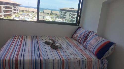Beira mar de Porto de Galinhas - Cupe Beach Living客房内的一张或多张床位