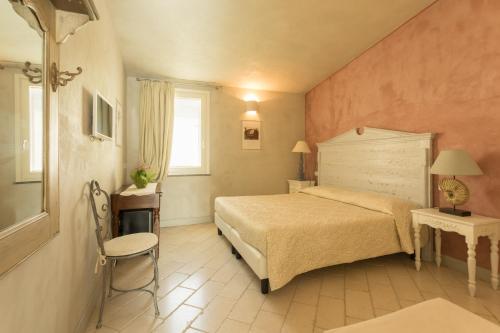 Il Cortiletto Hotel Maison客房内的一张或多张床位