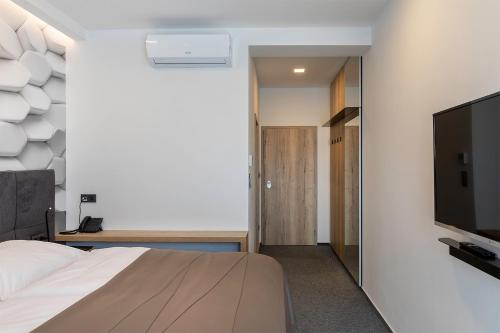 4 SMART HOTEL客房内的一张或多张床位