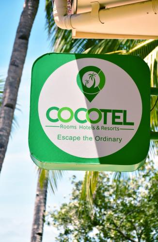 长滩岛Boracay Morning Beach Resort by Cocotel - Fully Vaccinated Staff的被占用的房间、酒店和度假村的标志,逃离了普通的