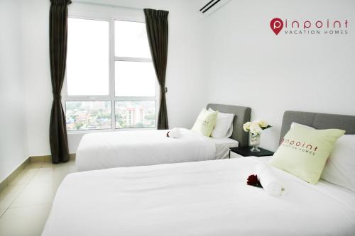 JB City Pinnacle Tower @Pinpoint Vacation Homes客房内的一张或多张床位