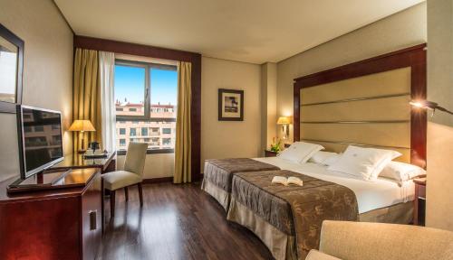 瓦伦西亚中心酒店客房内的一张或多张床位