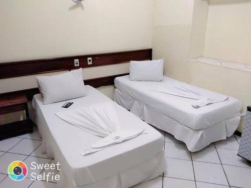 Hotel Central Rosário客房内的一张或多张床位
