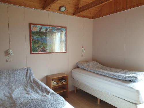 Við-Bót Riverside Cottage客房内的一张或多张床位