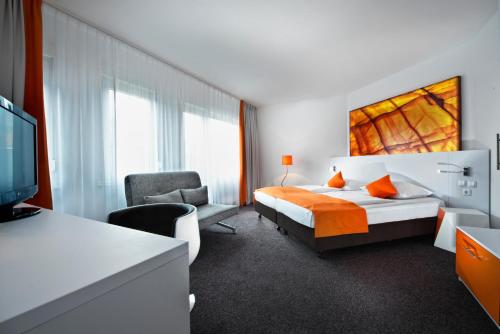 杜塞尔多夫市中心温德姆花园国王大道酒店客房内的一张或多张床位