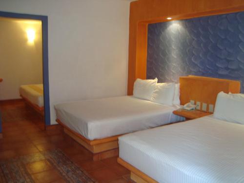 墨西哥别墅酒店客房内的一张或多张床位