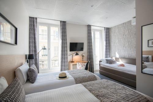 Hotel Saint Gothard客房内的一张或多张床位