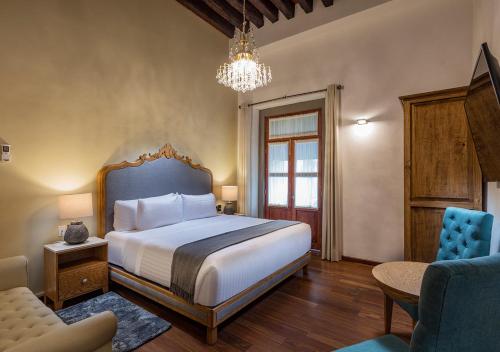 Hotel Casa Monarca客房内的一张或多张床位