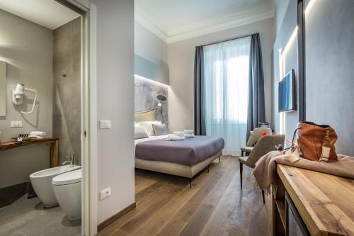 佛罗伦萨Palazzo dei Conti Residenza d'Epoca的一间酒店客房 - 带一张床和一间浴室