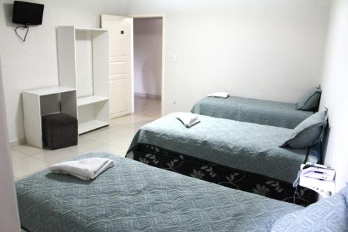 Hotel Aracaju Express客房内的一张或多张床位