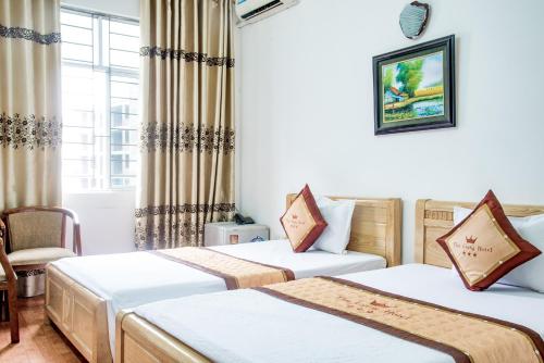 OYO 1143 Thu Giang Hotel客房内的一张或多张床位