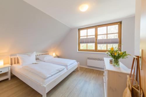 Doppelhaus am Deich 12客房内的一张或多张床位