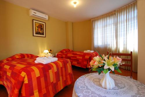阿尔及瑞亚纳斯卡酒店客房内的一张或多张床位