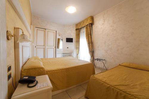 迪普罗玛皇宫酒店客房内的一张或多张床位