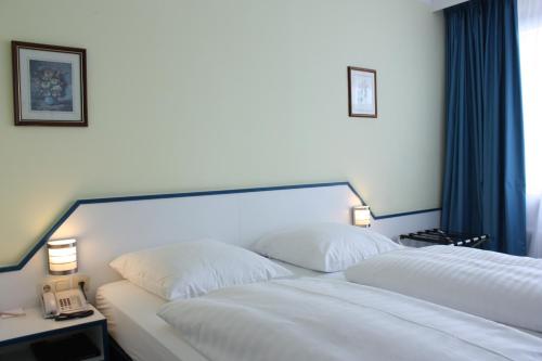 Hotel City Kräme am Römer - Self Check In客房内的一张或多张床位