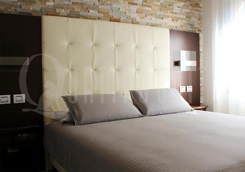 Quattro Gatti Rooms&Suite客房内的一张或多张床位