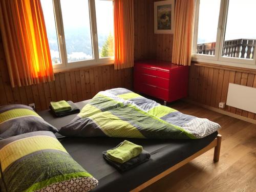 Chalet Casa Cresta - Top of Lenzerheide - bis 8 Personen客房内的一张或多张床位