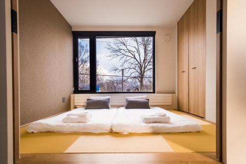 Niseko Central Houses and Apartments客房内的一张或多张床位
