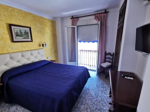 Hotel Doña Carmen客房内的一张或多张床位