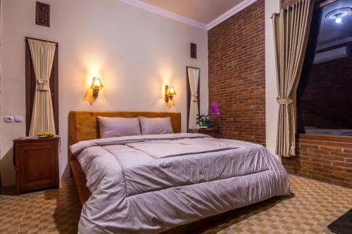 Maher House Borobudur客房内的一张或多张床位