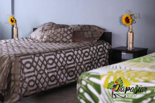 Pa Pasiar Hostal客房内的一张或多张床位