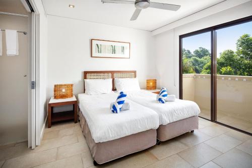 Temple 304 Modern Spacious Palm Cove Resort客房内的一张或多张床位