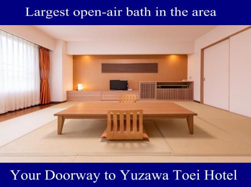 汤泽町汤泽东映酒店 的该地区最大的露天浴池 前往Vyuwa酒店