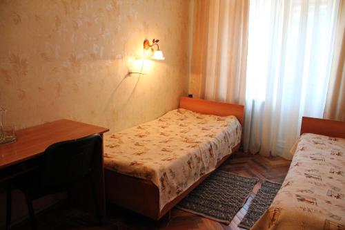 Essentukskaya Klinika Sanatorium客房内的一张或多张床位