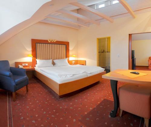 豪斯姆美尔施坦胡德酒店客房内的一张或多张床位