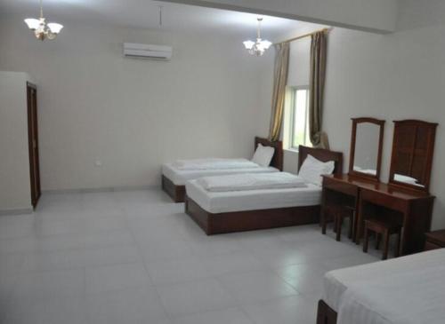 阿尔萨库拉维公寓式酒店客房内的一张或多张床位