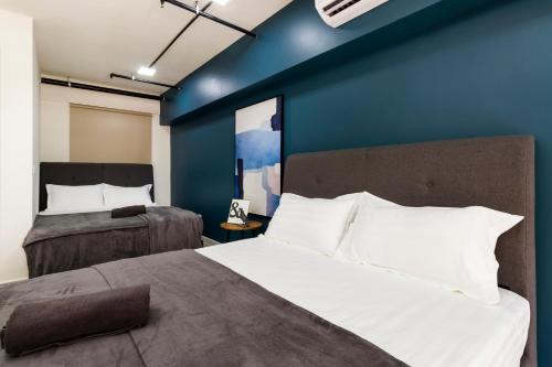 Tamarind Suites@Cyberjaya客房内的一张或多张床位