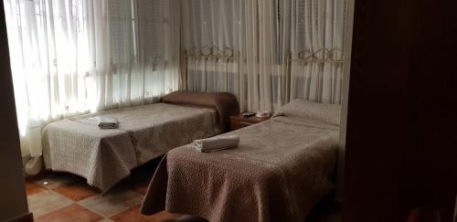 圣米格尔旅馆客房内的一张或多张床位
