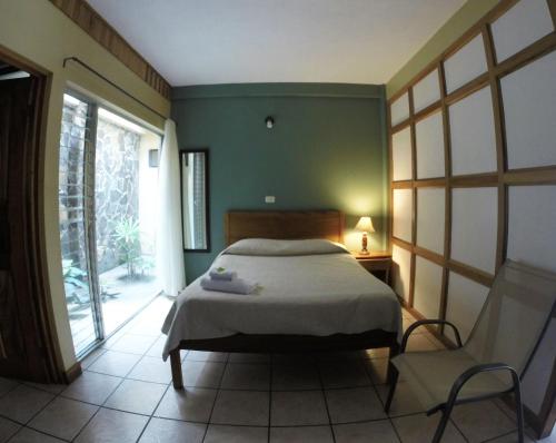 Hotel Guadalupe客房内的一张或多张床位