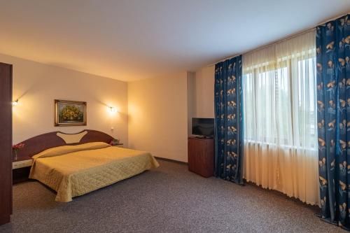 阿达莫酒店客房内的一张或多张床位