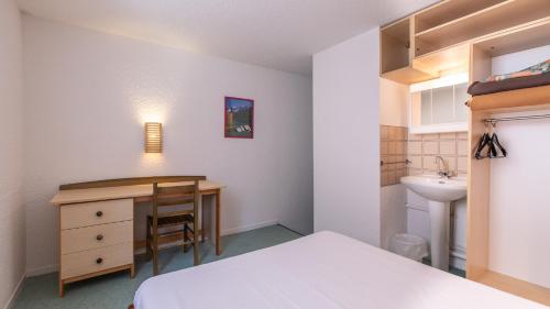 戈格斯拉基斯度假原住酒店客房内的一张或多张床位