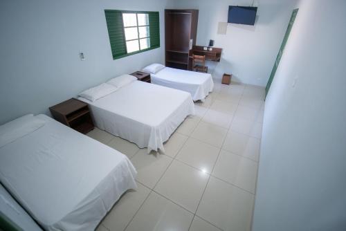 Hotel Campo Verde客房内的一张或多张床位