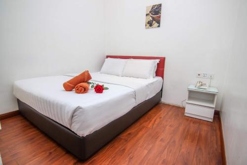 Rose Cottage Hotel Taman Nusa Cemerlang客房内的一张或多张床位