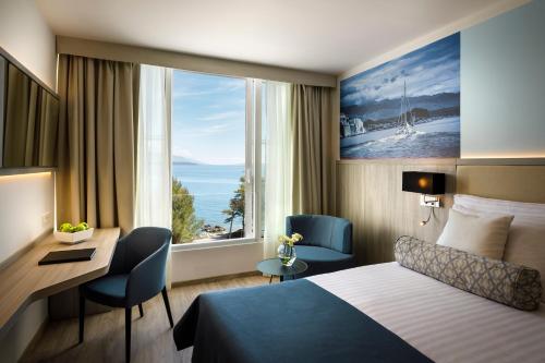 Valamar Carolina Hotel & Villas客房内的一张或多张床位