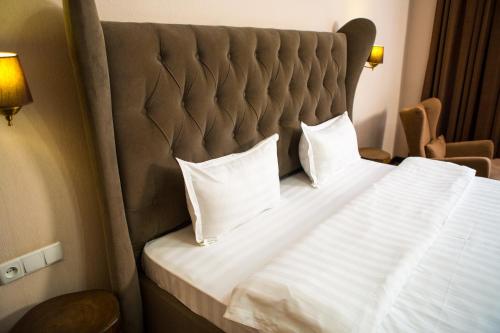 Keremet Hotel客房内的一张或多张床位