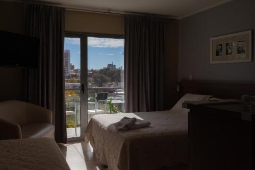 Apart Hotel Rivadavia 815客房内的一张或多张床位