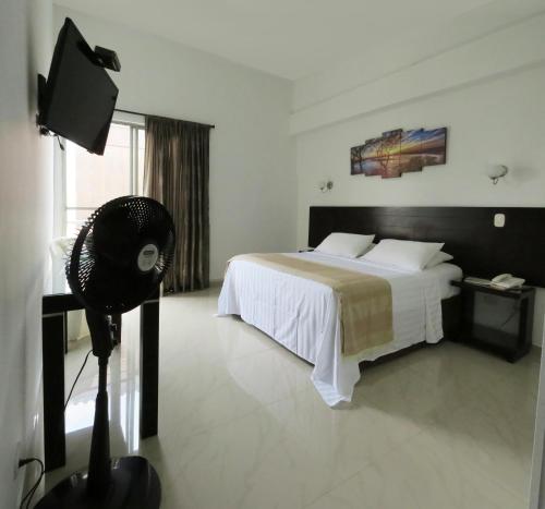 Hotel Estrella Palmira客房内的一张或多张床位