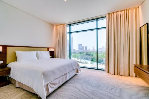Vida Emirates Hills Residences客房内的一张或多张床位