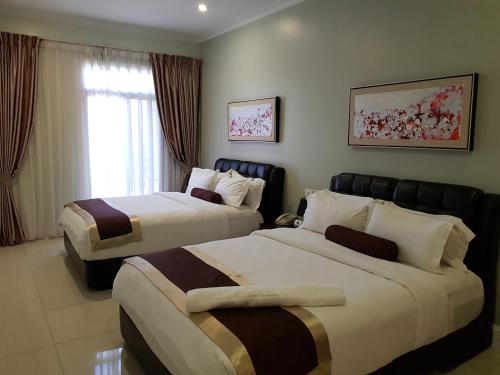 Lae City Hotel客房内的一张或多张床位