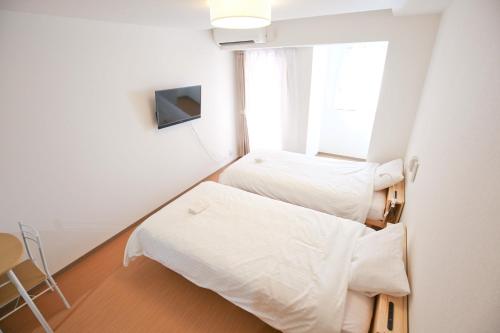 Connect Inn客房内的一张或多张床位