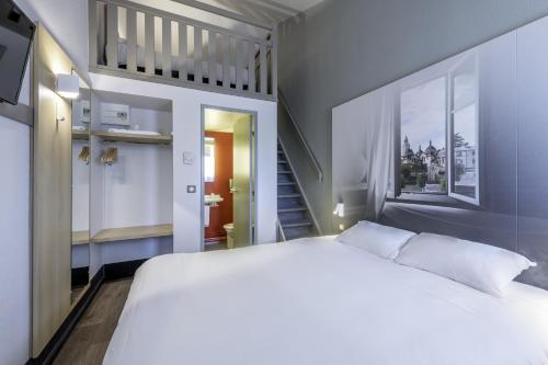 B&B HOTEL Périgueux Boulazac客房内的一张或多张床位