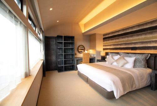 R&Run Kyoto Serviced Apartment & Suites客房内的一张或多张床位