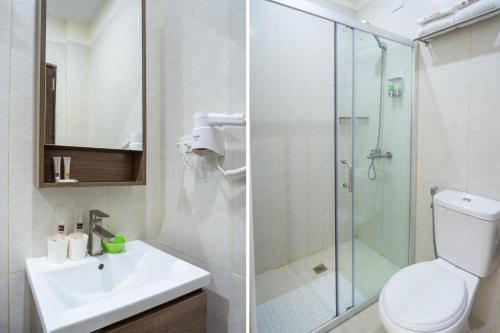 宿务18 Suites Cebu的浴室配有卫生间水槽和淋浴。