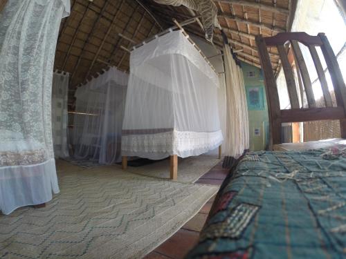 Mufasa Eco Lodge客房内的一张或多张床位
