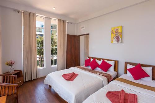 Ovi Court City Apartments Nuwara Eliya客房内的一张或多张床位